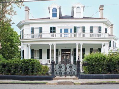A white mansion in the garden district of New Orleans